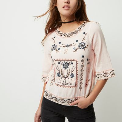 Light pink flared sleeve embroidered top